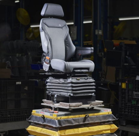 a John Deere tractor seat in a factory